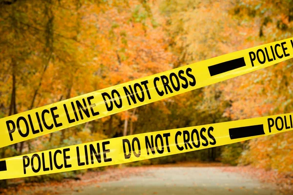 Yellow Police Tape Isolating Crime Scene Blurred View Autumn Park — Stock Photo, Image