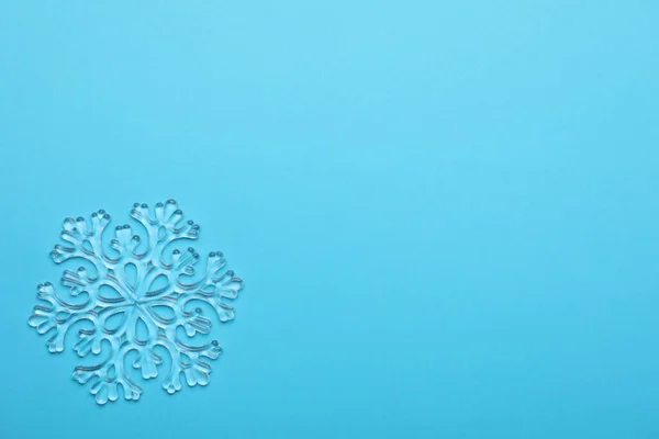 Beautiful Decorative Snowflake Light Blue Background Top View Space Text — Stock Photo, Image