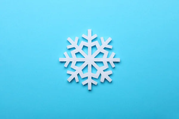 Beautiful Decorative Snowflake Light Blue Background Top View — Stock Photo, Image