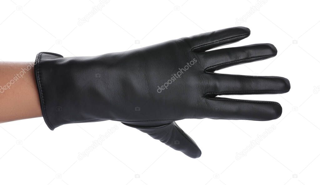 Woman wearing black leather glove on white background, closeup