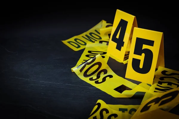 Crime Scene Tape Evidence Markers Black Slate Background Closeup Space — Stock Photo, Image