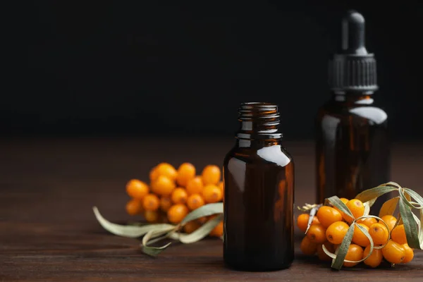 Natural Sea Buckthorn Oil Fresh Berries Wooden Table Space Text — Stock Photo, Image