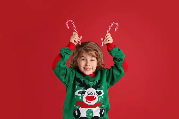 Cute Little Girl Christmas Sweater Holding Sweet Candy Canes Head — Stock Photo, Image