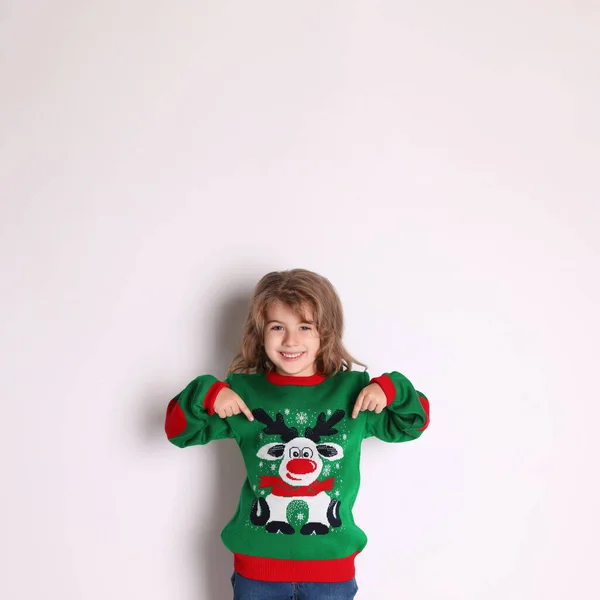 Cute Little Girl Pointing Her Green Christmas Sweater White Background — Stock Photo, Image