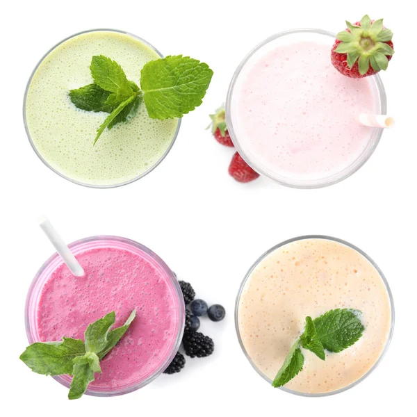 Set Mit Verschiedenen Leckeren Milchshakes Auf Weißem Hintergrund Draufsicht — Stockfoto