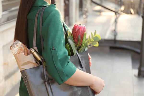 Woman with leather shopper bag outdoors, closeup