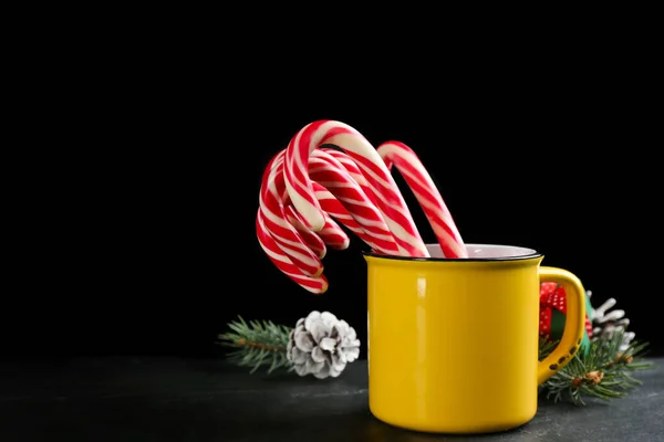 Christmas Candy Canes Cup Black Table Dark Background Space Text — Stock Photo, Image