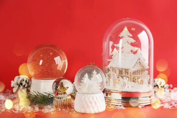 Beautiful Christmas Snow Globes Red Background Bokeh Effect — Stock Photo, Image