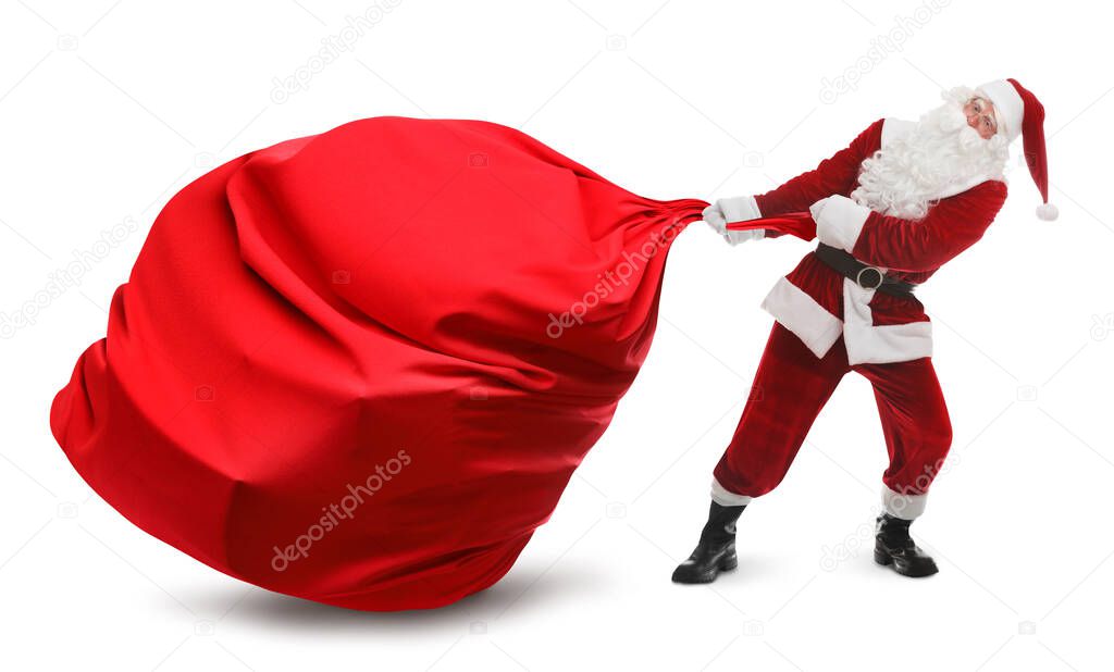 Santa Claus pulling enormous red bag full of Christmas gifts on white background