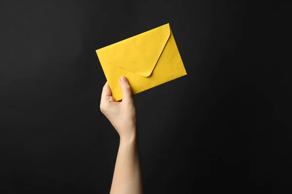 Woman Holding Yellow Paper Envelope Black Background Closeup — Stock Photo, Image