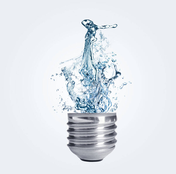 Light bulb with water splashes on light background. Alternative energy source