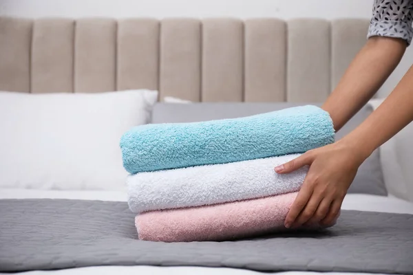 Woman Putting Soft Clean Terry Towels Bed Closeup — Stock Photo, Image