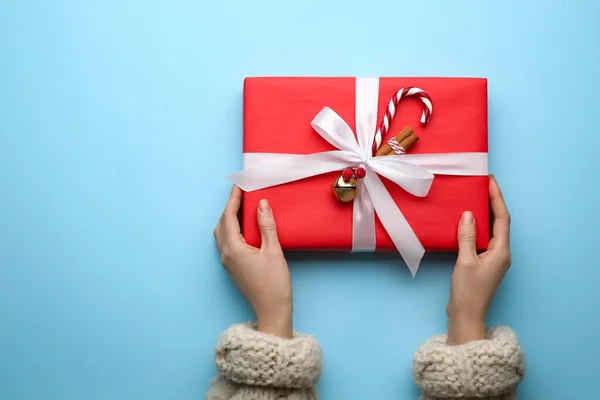 Woman Holding Red Christmas Gift Box Light Blue Background Top — Stock Photo, Image