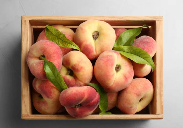 Fresh Ripe Donut Peaches Crate Light Table Top View — Stock Photo, Image