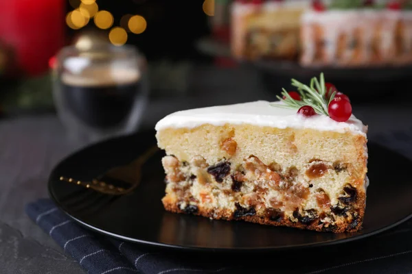 Slice Traditional Christmas Cake Decorated Rosemary Cranberries Black Table Closeup — Stock Photo, Image