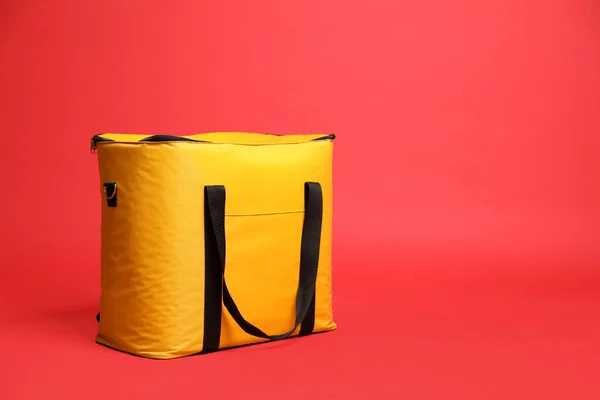 Modern Yellow Thermo Bag Red Background Space Text — Fotografia de Stock