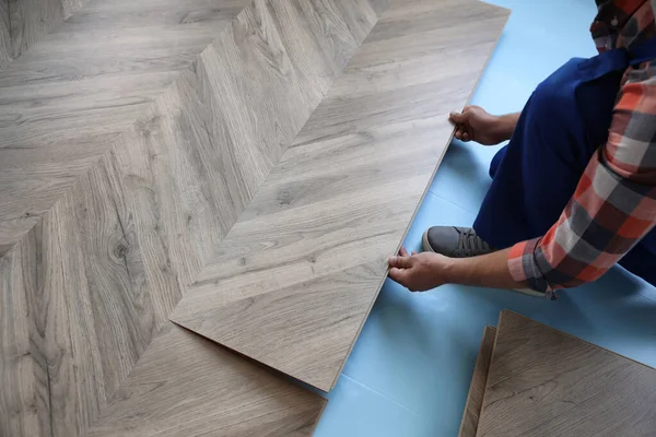 Worker Installing Laminated Wooden Floor Indoors Closeup — Stock Photo, Image