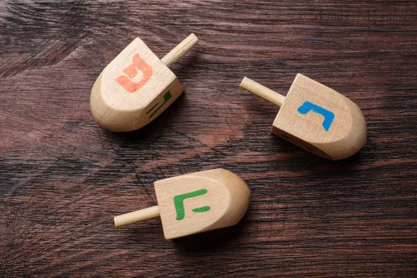 Hanukkah Traditional Dreidels Letters Nun Wooden Table Flat Lay — Stok fotoğraf