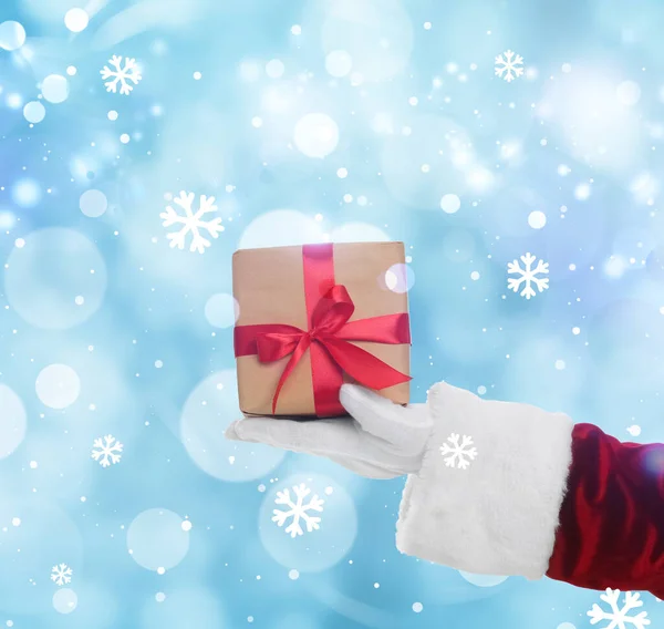 Santa Claus Holding Gift Box Winter Background Bokeh Effect — Stock Photo, Image