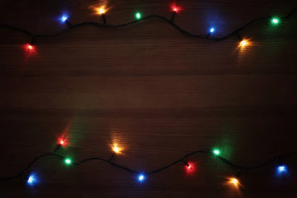 Frame Colorful Christmas Lights Wooden Table Top View Space Text — Stock Photo, Image