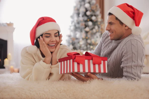 Boyfriend Giving Christmas Gift Box His Girlfriend Home — Stock Photo, Image