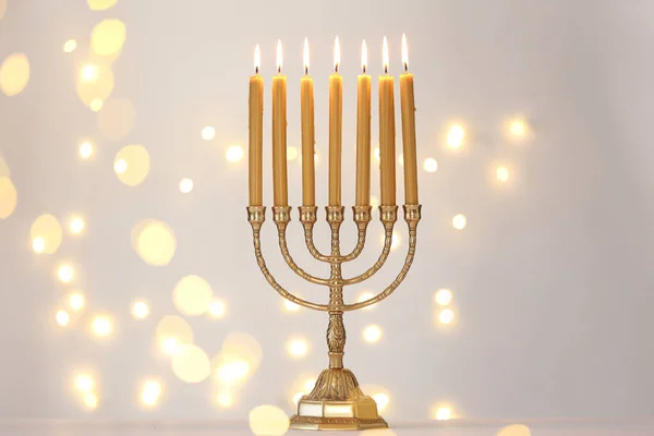 Golden Menorah Burning Candles Light Grey Background Blurred Festive Lights — Stock Photo, Image