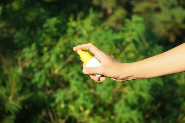 Woman Holding Insect Repellent Outdoors Closeup View — Stock Photo, Image