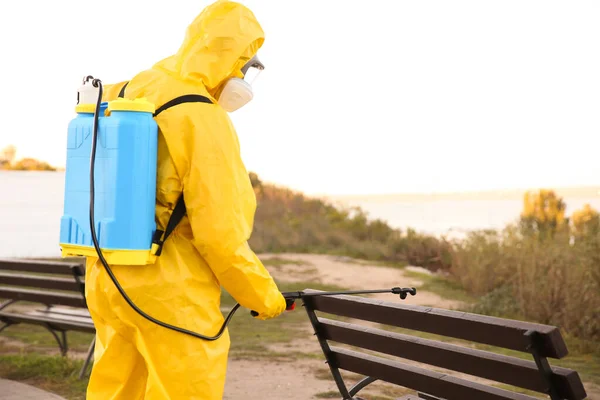 Person Hazmat Suit Disinfecting Bench Park Sprayer Back View Surface — Stock Photo, Image