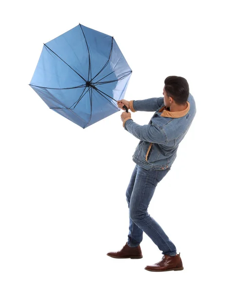 Beyaz Arka Planda Rüzgarın Esintisine Kapılmış Şemsiyeli Bir Adam — Stok fotoğraf
