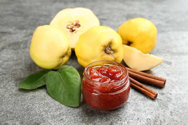 Delicious Quince Jam Fruits Cinnamon Grey Table — Stok fotoğraf