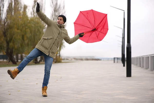 Man Red Umbrella Caught Gust Wind Outdoors — Stock Photo, Image