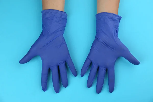 Person Medical Gloves Light Blue Background Top View — Stock Photo, Image