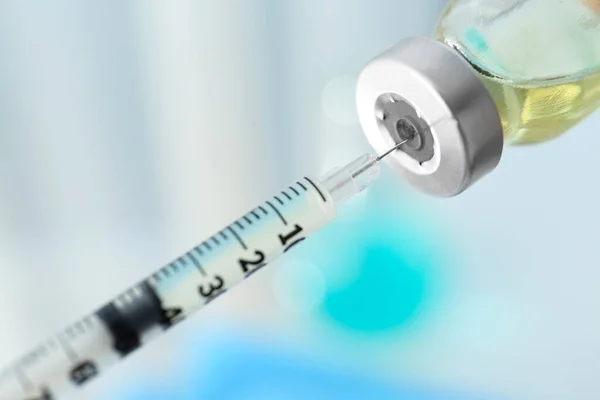 stock image Filling syringe with vaccine on blurred background, closeup