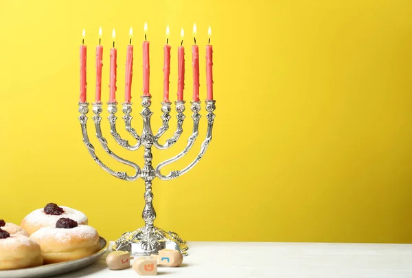 Silver Menorah Sufganiyot Dreidels Symbols Nun Gimel Yellow Background Space — Stock Photo, Image