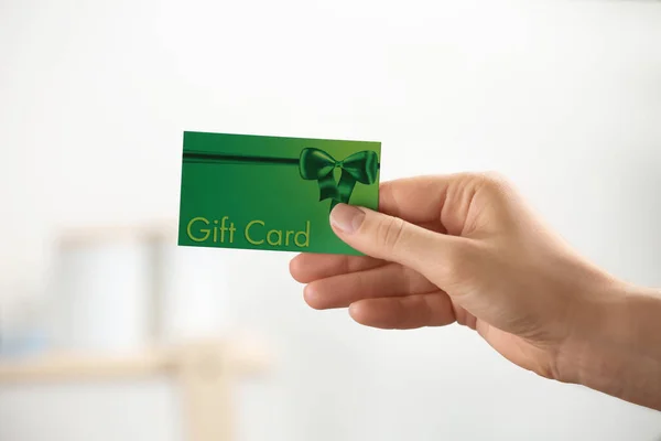 Woman Holding Gift Card Blurred Background Closeup — Stock Photo, Image