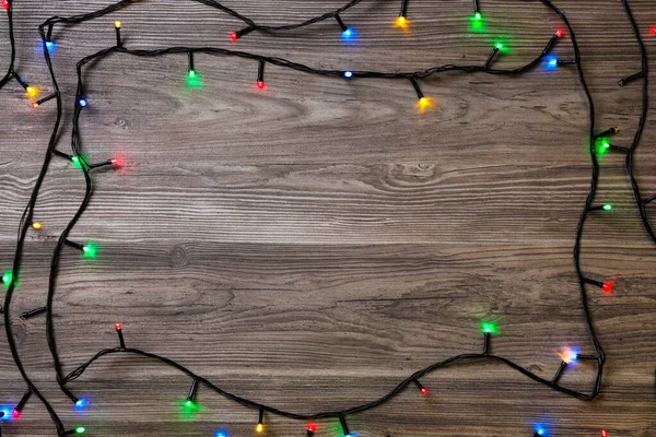 Rahmen Der Weihnachtsbeleuchtung Auf Holztisch Draufsicht Raum Für Text — Stockfoto