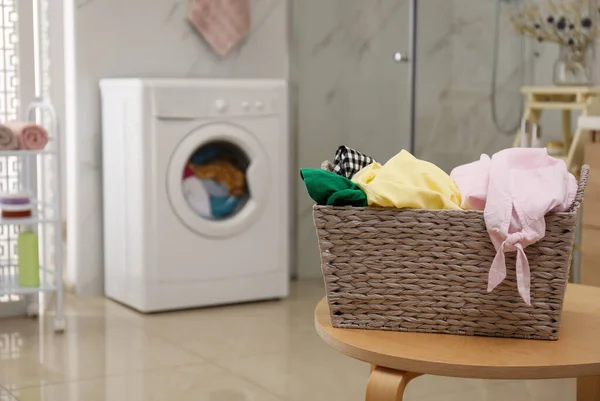 Wicker Laundry Basket Full Different Clothes Table Bathroom — Stock Photo, Image