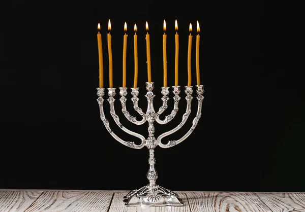 Silver Menorah Med Brinnande Ljus Bordet Mot Svart Bakgrund Hanukkah — Stockfoto