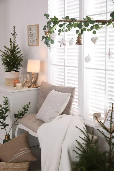 Beautiful room interior decorated for Christmas with potted firs