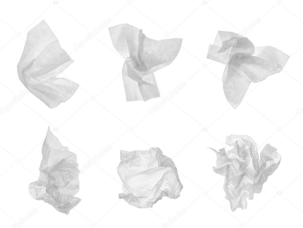 Set with used crumpled paper tissues on white background