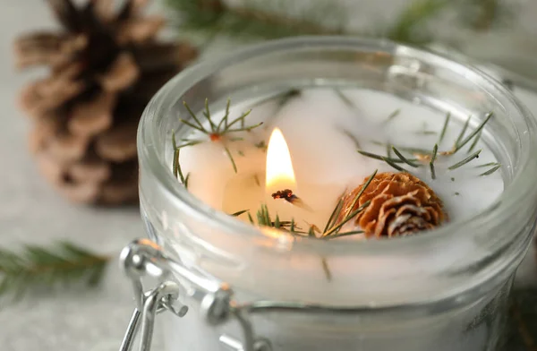 Burning Scented Conifer Candle Glass Jar Closeup View — Stock Photo, Image