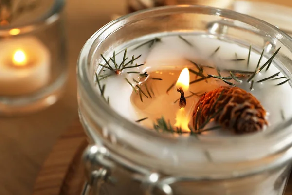 Burning Scented Conifer Candle Glass Jar Closeup View — Stock Photo, Image