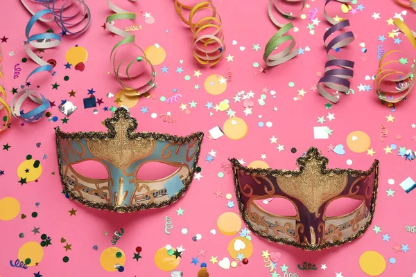 Beautiful Carnival Masks Party Decor Pink Background Flat Lay — Stock Photo, Image