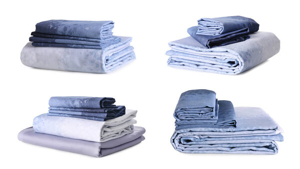 Set with stacks of clean bed linen on white background