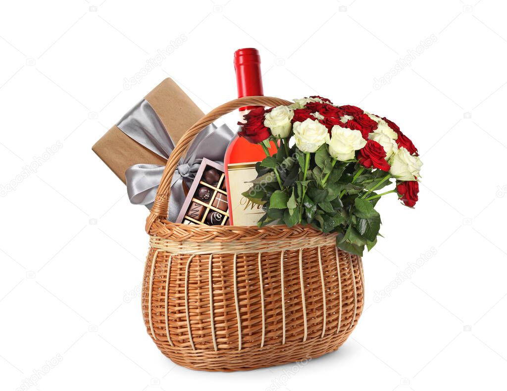 Wicker basket with gifts on white background