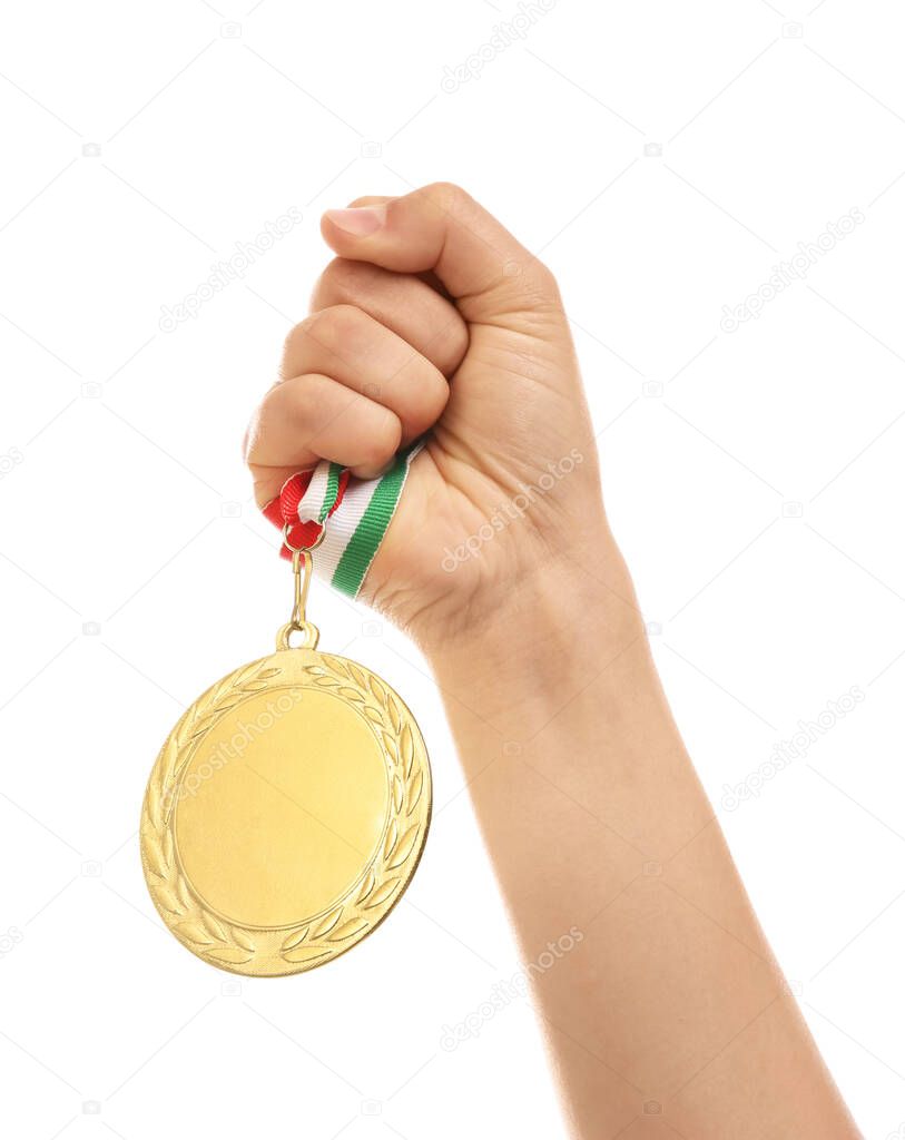 Woman holding gold medal on white background, closeup