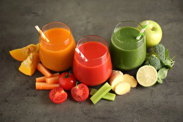 Different Tasty Juices Fresh Ingredients Grey Table — Stock Photo, Image