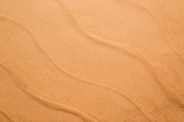 ベージュきれいなビーチの砂を背景に トップビュー 夏休み — ストック写真