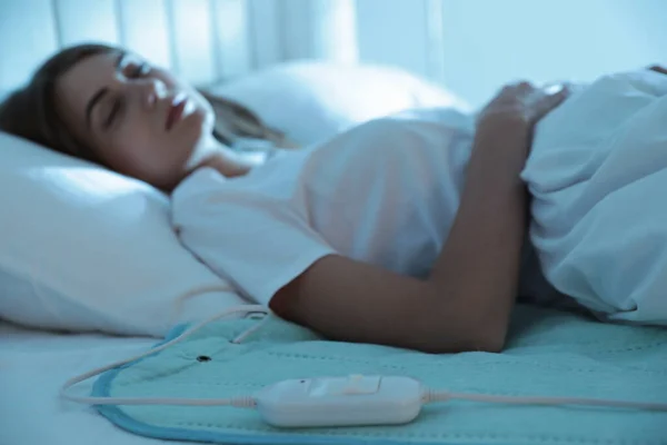 Young Woman Sleeping Bed Electric Heating Pad Focus Cable — Stock Photo, Image