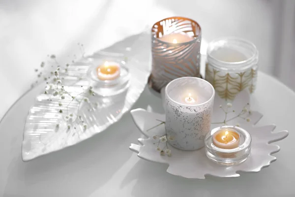 Burning Candles Beautiful Holders Flowers Table Indoors — Stock Photo, Image